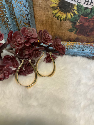 Faux gold elongated hoop earrings, approx. 1.5 inches long, lightweight modern design