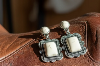 Silver-tone western drop earrings with square frames and white buffalo–style stones with subtle gray veining.