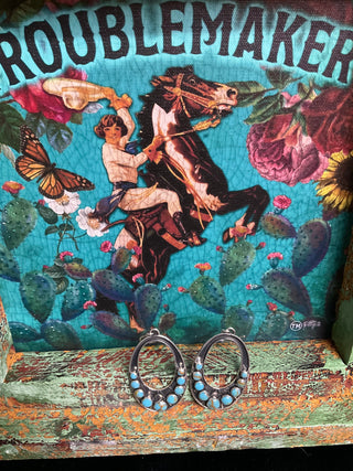 Statement sterling silver turquoise earrings with oval silhouette and classic western styling