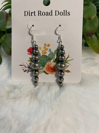 Sterling silver pearl dangle earrings with graduated bead design and timeless western styling