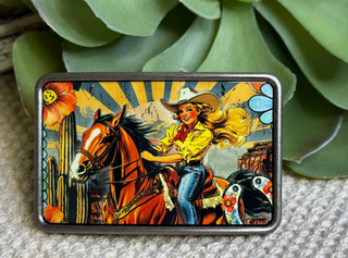 Western belt buckle with cowgirl riding horse at sunrise cactus and floral design
