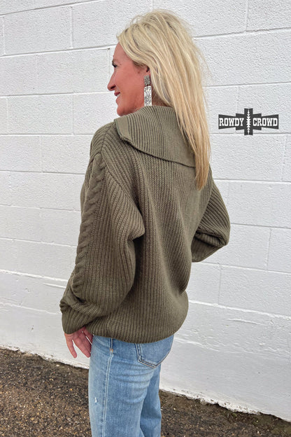 olive quarter zip pullover sweater with frayed accent at base of zipper and cable knit stripe down sleeve