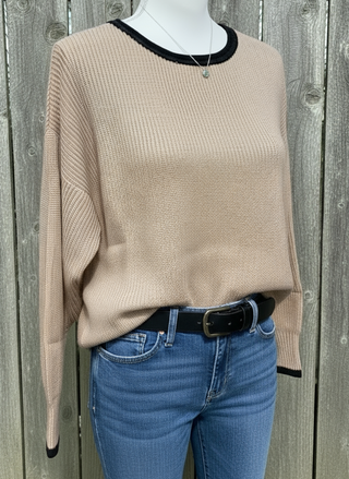 Khaki women’s knit sweater with boat neckline, black contrast trim, drop shoulders, and scalloped hem