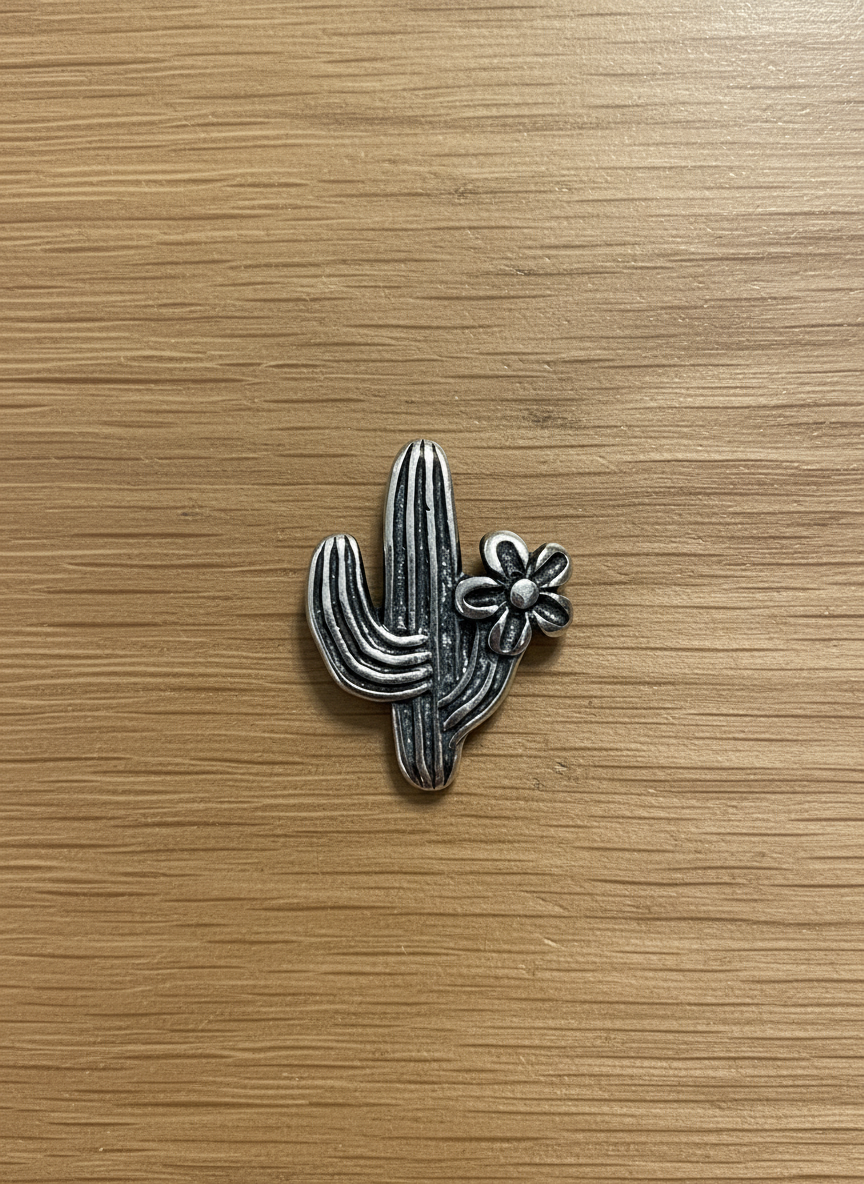 Dainty sterling silver saguaro cactus stud earrings with tiny blooming detail, minimal western design.