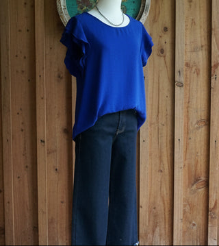 Women's royal blue blouse featuring lightweight woven fabric and flutter sleeves