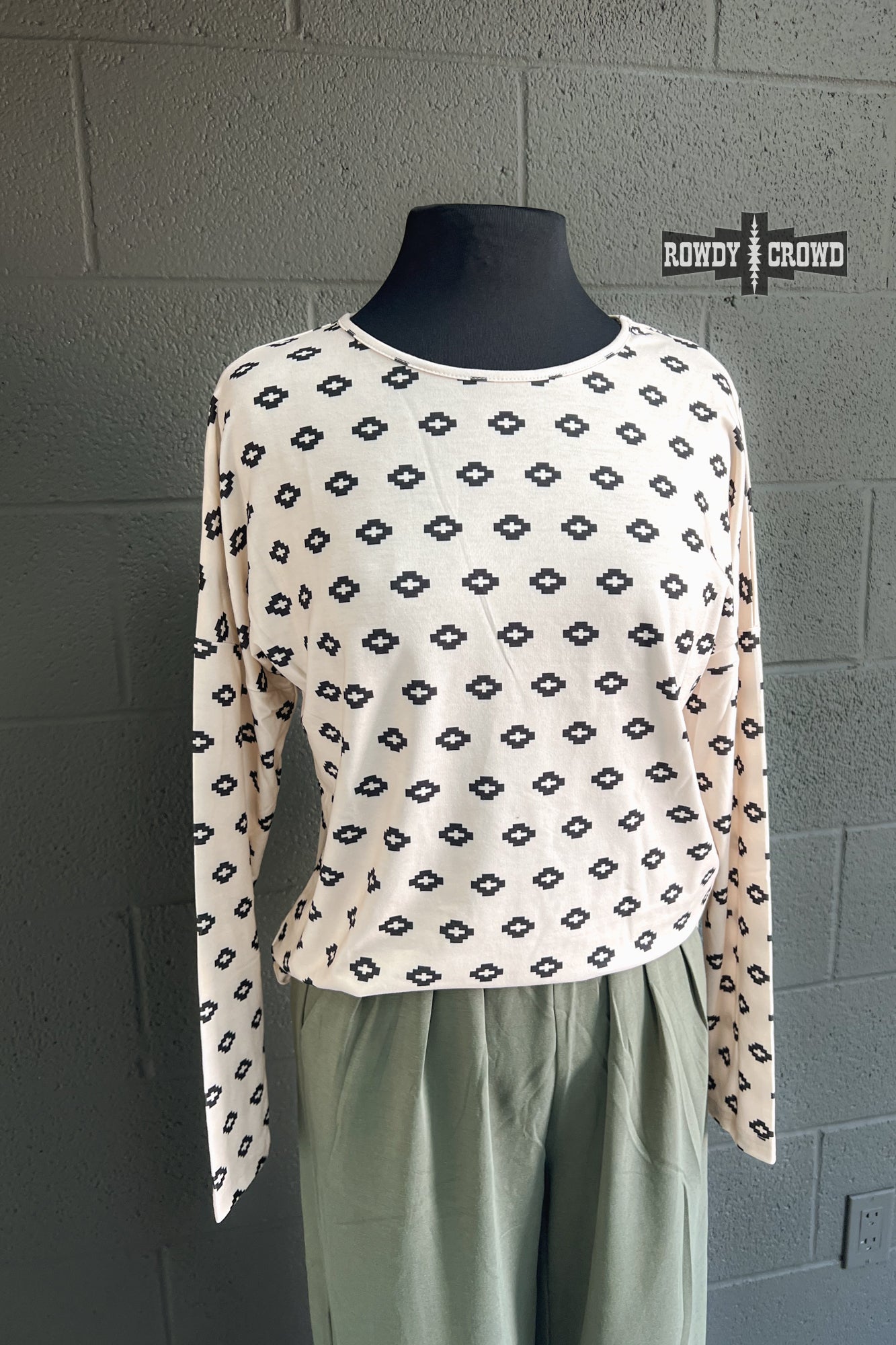 cream colored stretchy long sleeve tee with small black Aztec inspired pattern