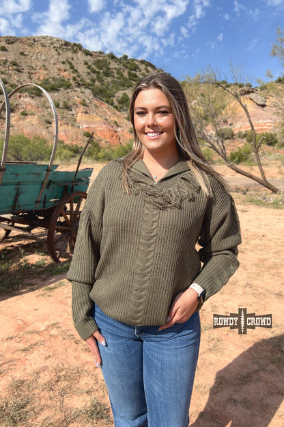 olive quarter zip pullover sweater with frayed accent at base of zipper and cable knit stripe down sleeve