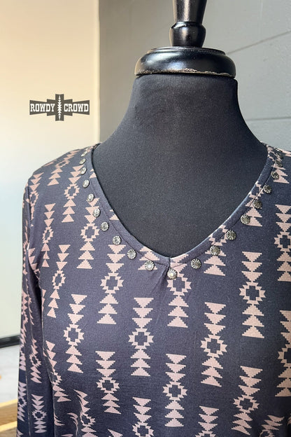 black long sleeve v neck top with tan Aztec print and concho accents at neckline