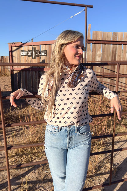 cream colored stretchy long sleeve tee with small black Aztec inspired pattern