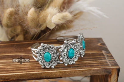 three band silver toned cuff bracelet with three scalloped pendants with turquoise stone accents