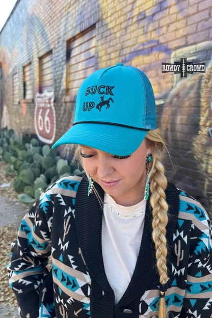 teal trucker cap with black bucking horse graphic and words BUCK UP