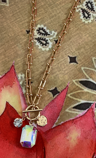 Boutique gold necklace set available with clear, black, or blue crystal