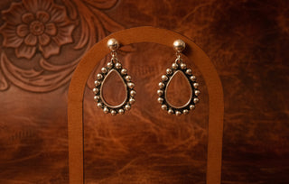 Boutique silver fashion earrings featuring polished bead detailing