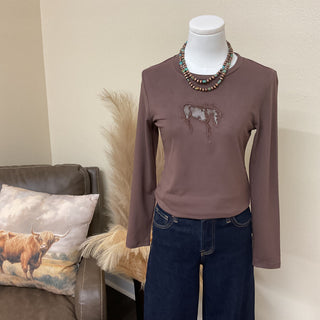 Western-inspired long sleeve knit top styled with Risen jeans and turquoise jewelry.
