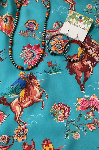 Lightweight western button-up shirt featuring pearl snaps, bucking horses, and cuffed short sleeves.