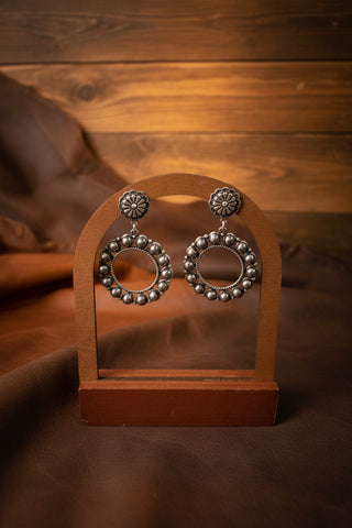 Silver toned western concho drop earrings with AB center stones and open circular bead detailing