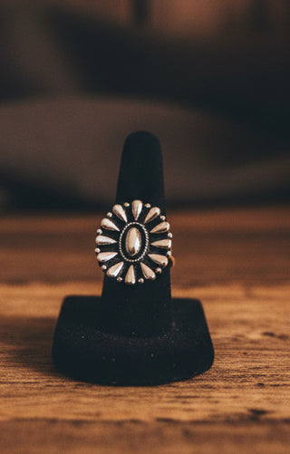 Silver tone adjustable concho fashion ring with antique western finish.